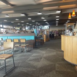 a restaurant with tables and chairs a restaurant with tables and chairs