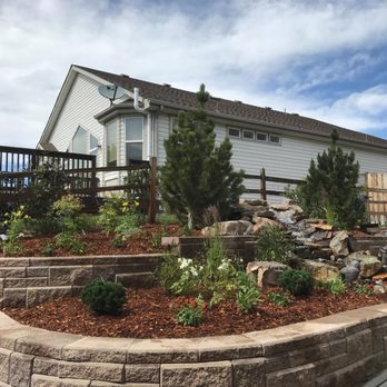 Residential Landscape - a house with a retaining wall - Landscaping Near Me Residential Landscape - a house with a retaining wall - Landscaping Near Me