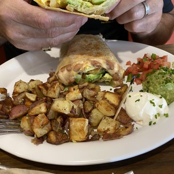 Chad's - California burrito. It has eggs, avocado, pinto beans, french fries & bacon! YUM - Breakfast & Brunch Near Me - Santa Barbara, California