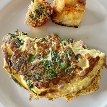 Cafe Le Reve - Le Porc omelette - champagnard ham, bacon, mushrooms, spinach and gruyere cheese along with cafe pave potatoes. - Breakfast & Brunch Near Me - Riverside, California Cafe Le Reve - Le Porc omelette - champagnard ham, bacon, mushrooms, spinach and gruyere cheese along with cafe pave potatoes. - Breakfast & Brunch Near Me - Riverside, California