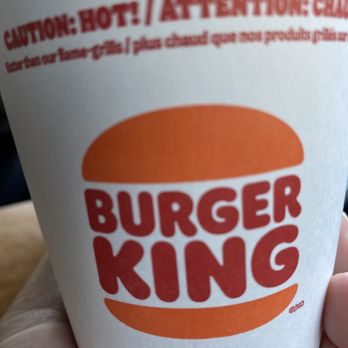 Burger King - a hand holding a cup of coffee - Burgers Near Me - Riverside, California Burger King - a hand holding a cup of coffee - Burgers Near Me - Riverside, California