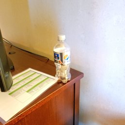 a trash that was left by previous guest behind the TV