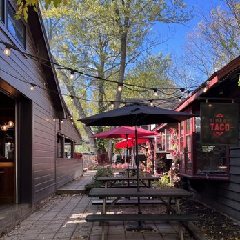 Tinker Taco - a patio area with tables and umbrellas - Mexican Near Me - Woodstock, New York Tinker Taco - a patio area with tables and umbrellas - Mexican Near Me - Woodstock, New York