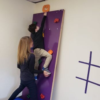 STEP Therapy Pediatrics - Reaching for success! Climbing the rock wall to the top with his physical therapist for the very first time! - Occupational Therapy Near Me - Greenwood Village, Colorado STEP Therapy Pediatrics - Reaching for success! Climbing the rock wall to the top with his physical therapist for the very first time! - Occupational Therapy Near Me - Greenwood Village, Colorado
