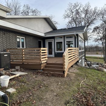 903 Carpentry - the front of a house with a deck and steps leading up to the front door - Decks & Railing Near Me - Waunakee, Wisconsin 903 Carpentry - the front of a house with a deck and steps leading up to the front door - Decks & Railing Near Me - Waunakee, Wisconsin