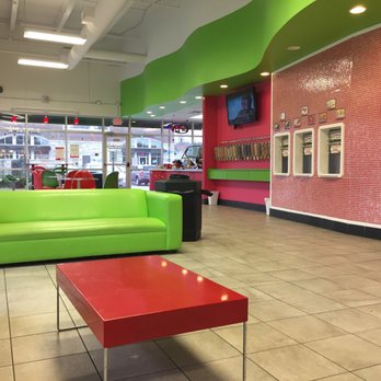 Cherryberry - a bright green couch and red coffee table - Desserts Near Me - Rochester, Minnesota