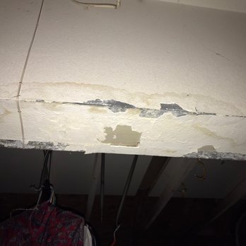 ServiceMaster Recovery Services by 24/7 - Before picture of damaged area in garage; water leak from roof. - Damage Restoration Near Me - Riverside, California