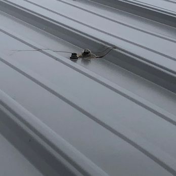 Prominent Construction - screw missed the wood, so they tried to caulk it instead of replacing the piece. - Roofing Near Me - Minnetonka, Minnesota