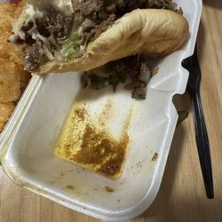 Bumpers Drive In - Pooled grease / oil beneath grease soaked Philly cheesecake sandwich