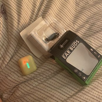 Smith's - a cell phone and a game controller on a bed - Grocery Near Me - Albuquerque, New Mexico