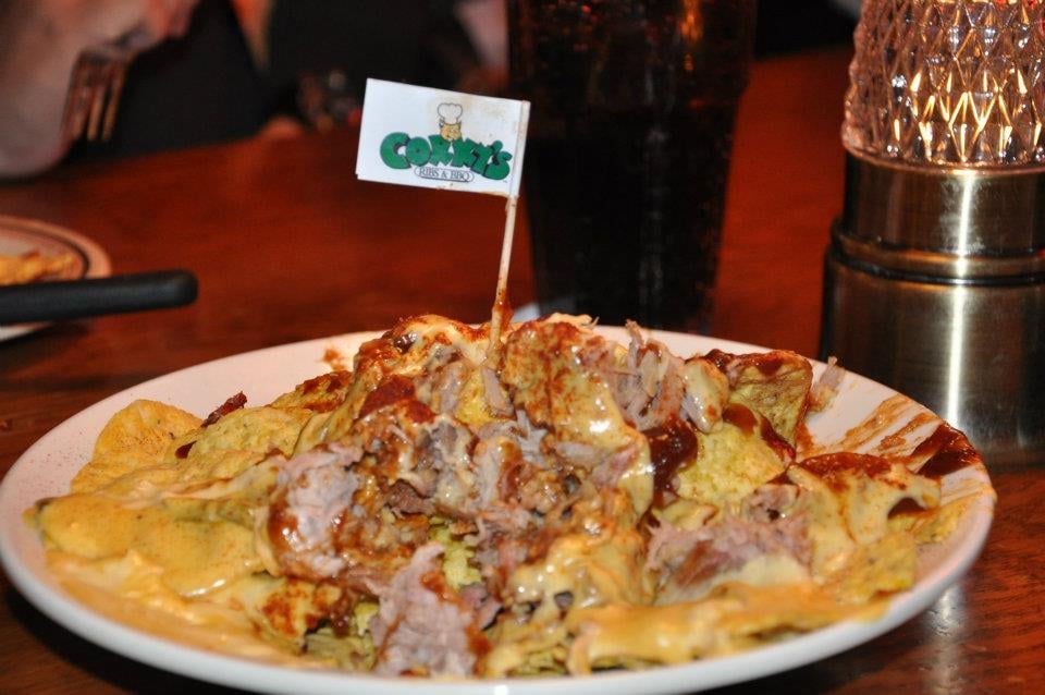 Photo of Corky's Ribs & BBQ - Memphis, TN, United States. nachos topped with bbq pulled pork