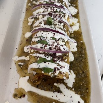 Ammatoli - Hola Shawarma - if you're hungry and yes, it looks like a wet burrito or giant enchilada, you got to try this! Mouthwatering goodness! - Mediterranean Near Me - Long Beach, California