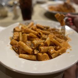 Stefano's Trattoria - Rigatoni Crema Di Formaggio (special) Rigatoni pasta sauteed in a pink sauce with prosciutto, chicken, sausage and diced onion