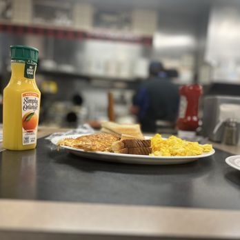 Waffle House - a plate of breakfast food and a bottle of orange juice - American Near Me - Greensboro, North Carolina Waffle House - a plate of breakfast food and a bottle of orange juice - American Near Me - Greensboro, North Carolina