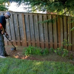 Junk Busters - Lucas weeding one of the beds, he's a great person, diligent worker, very polite.