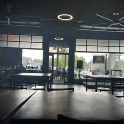 Bevo Caffe Lounge - Enclosed area with windows open, outdoor patio seating. Not pictured: indoor bar