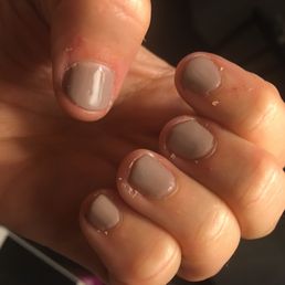 Uneven nails, color on the skin and no trimming of skin around the nail bed. Uneven nails, color on the skin and no trimming of skin around the nail bed.