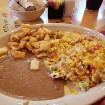 Los Chilakillers - Migas with potatoes and beans served with warmed verse sauce. - Mexican Near Me - Austin, Texas