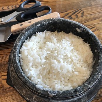 BCD Tofu House - Rice in hot stone pot that we had to scoop it out ourselves. If you not careful, you will get burned - Korean Near Me - Rowland Heights, California BCD Tofu House - Rice in hot stone pot that we had to scoop it out ourselves. If you not careful, you will get burned - Korean Near Me - Rowland Heights, California