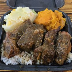 Caribbean Jerk ribs with rice, sweet potatoes and mashed potatoes