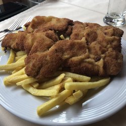Restaurant Allmendhuisli - Pork schnitzel over fries