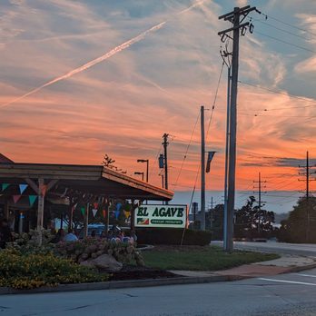 El Agave - the sun setting behind a restaurant - Mexican Near Me - Saint Louis, Missouri El Agave - the sun setting behind a restaurant - Mexican Near Me - Saint Louis, Missouri