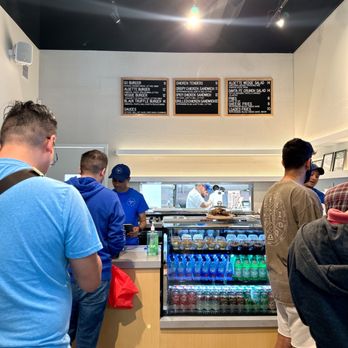 Aloette Go - a group of people at a counter - Burgers Near Me - Toronto, Ontario Aloette Go - a group of people at a counter - Burgers Near Me - Toronto, Ontario