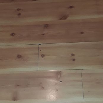 Momentum Tile & Stone - Old water damaged pergo floor - Flooring Near Me Momentum Tile & Stone - Old water damaged pergo floor - Flooring Near Me