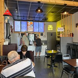 Philly's Famous Cheesesteaks And More - The counter from the corner high top booth