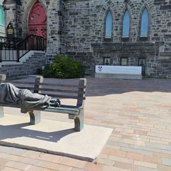 Christ Church Cathedral Anglican Sparks & Bronson - If you look closely at the sculpture there are crucifixion scars on the feet, suggesting the figure is actually Christ.