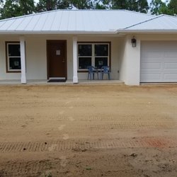 Stewart Construction - Almost finished.  Cement driveway, sidewalk and 15 pallets of sod still to come.