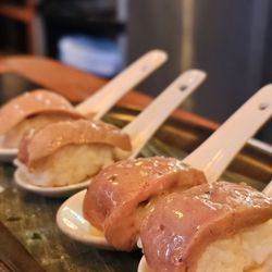Au Pied de Cochon - Foie nigiri. One order comes with 4 spoons $29