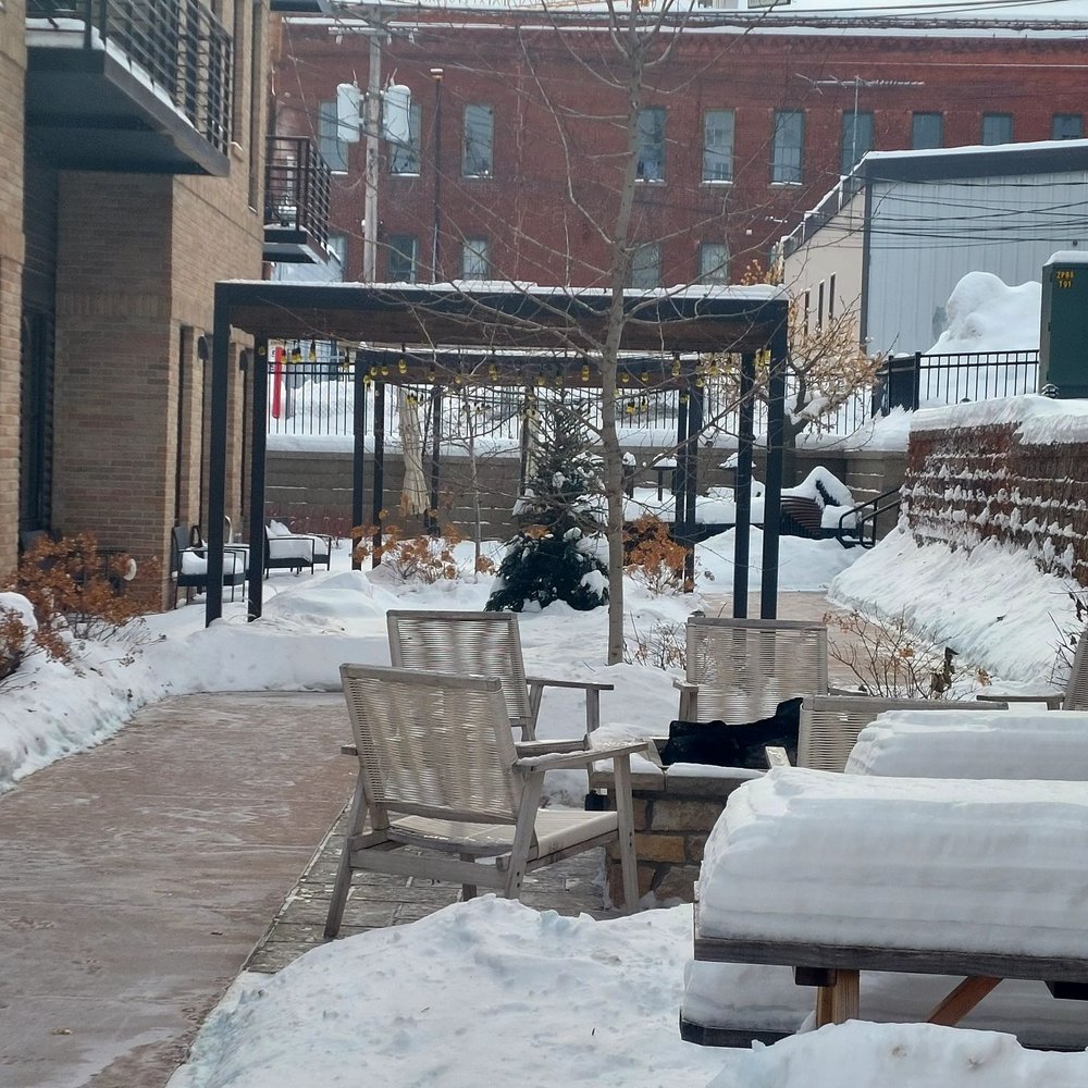 Hotel Crosby - Ground level patio with fire pit - Hotels Near Me - Stillwater, Minnesota