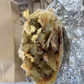 Kono's Northshore - 2nd half of Chun's breakfast bomber - mostly meat/undercooked potatoes/cheese. - Sandwiches Near Me - Kailua, Hawaii Kono's Northshore - 2nd half of Chun's breakfast bomber - mostly meat/undercooked potatoes/cheese. - Sandwiches Near Me - Kailua, Hawaii