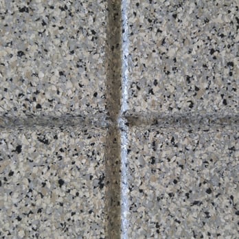 Epoxy Armor Systems - A super close-up. Notice the creme, beige, light grey, and black flecks spread evenly throughout. - Flooring Near Me - Rancho Cordova, California