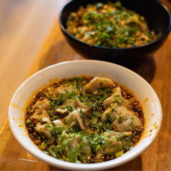Lao Peng You - two bowls of food on a table - Chinese Near Me - Chicago, Illinois Lao Peng You - two bowls of food on a table - Chinese Near Me - Chicago, Illinois