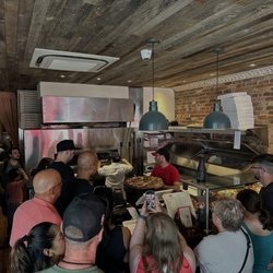 Scott's Pizza Tours - Scott explaining the coal oven process