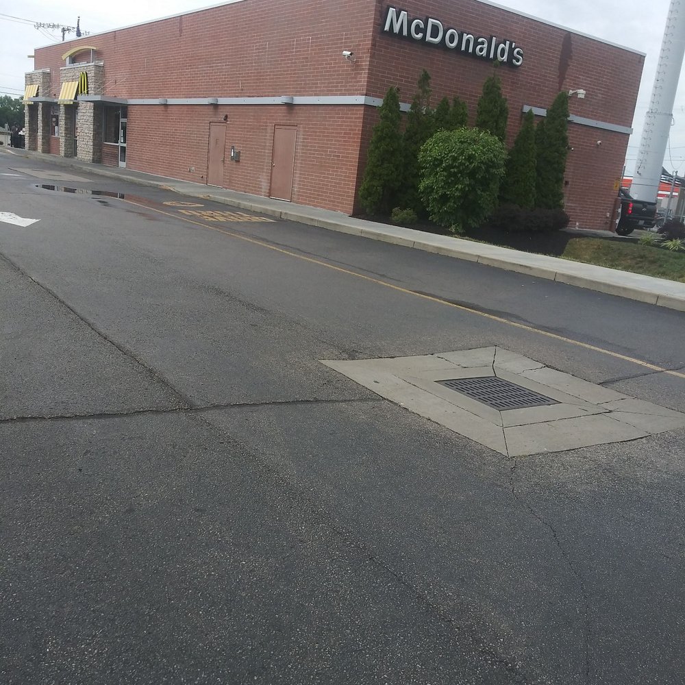 the empty street in front of a mcdonald's the empty street in front of a mcdonald's