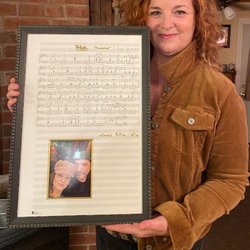 As You Like It Gallery & Frame Studio - Chopin's 'Raindrop' Prelude hand penned by this woman's boyfriend. We include a sweet picture of the 2 of them.
