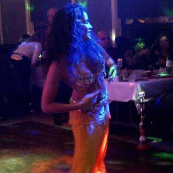 Mandaloun Resto Lounge - a woman dancing at a party - Bars Near Me - Ottawa, Ontario