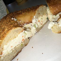 Garlic bagel toasted w/ vegetable cream cheese, orange juice, and coffee