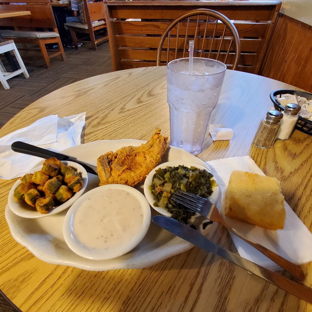 PO Folks - 1 Center Cut Pork Chop dinner with okra, greens & a side bowl of white gravy! The white gravy is a must for dipping the fried okra . - Southern Near Me - Lynn Haven, Florida