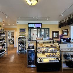 Lavender Wind - Inside Lavender Wind store showing our bakery case, infused oils, wine, honey and other various products in Coupeville, Washington