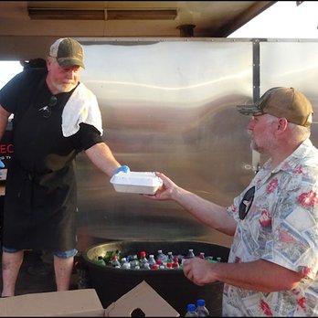 Lonny Boy's Barbeque - Lonny himself hands a veteran his complimentary dinner, with a "thank you for your service," along with a smile. - Barbeque Near Me - Hurricane, Utah