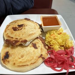 La Casa Vieja - Chicken papusa with pickled cable and onions. The sauce is a thin, no heat tomato "dip".