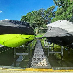 Tandem 2,000 LB Basta jet ski lifts with center walkway for easy boarding