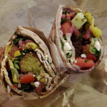 Luna Grill Irvine Spectrum Center - Falafel wrap: lavash, marinated kale, olives, pepperocini, feta, tomato, cucumbers, red onion. About $10 - Mediterranean Near Me - Irvine, California Luna Grill Irvine Spectrum Center - Falafel wrap: lavash, marinated kale, olives, pepperocini, feta, tomato, cucumbers, red onion. About $10 - Mediterranean Near Me - Irvine, California