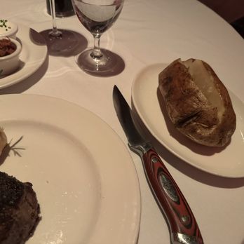 Strip House Steakhouse - Baked potato with all the fixings. - Steakhouses Near Me - Las Vegas, Nevada Strip House Steakhouse - Baked potato with all the fixings. - Steakhouses Near Me - Las Vegas, Nevada