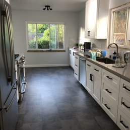 a kitchen with white cabinets