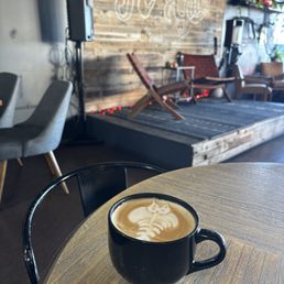 Latte art in a mug at a coffee shop Latte art in a mug at a coffee shop